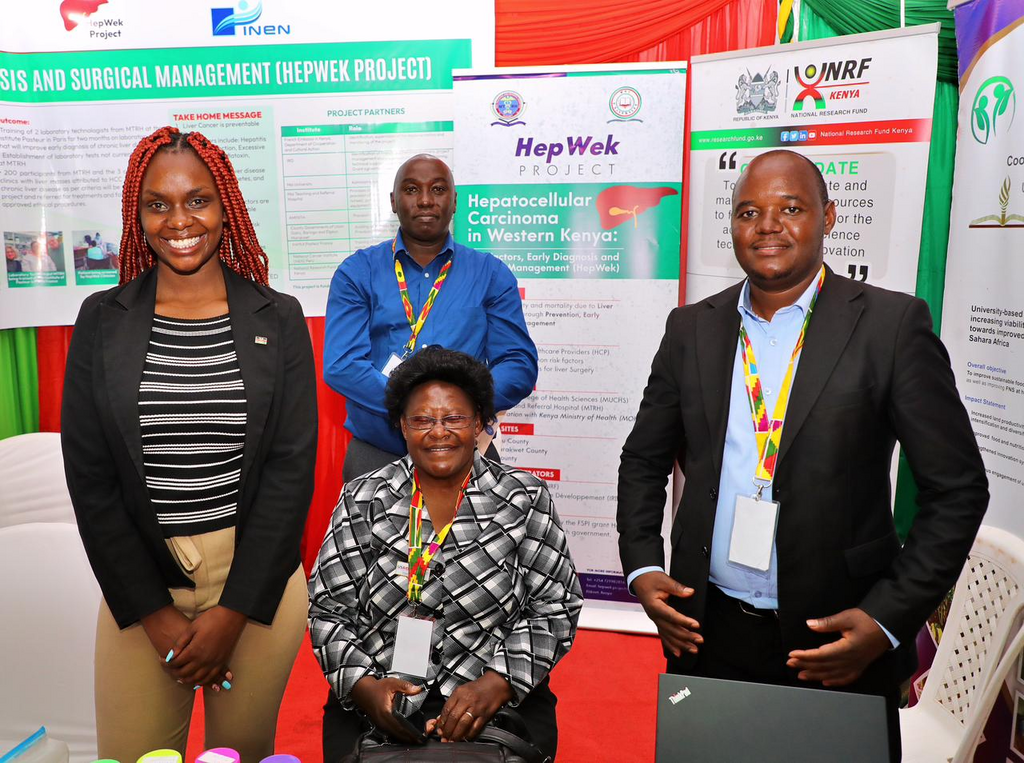 Dr Charlotte Serrem (seated) with NRF staff at the 8th CoG Devolution Conference held in Uasin Gishu County